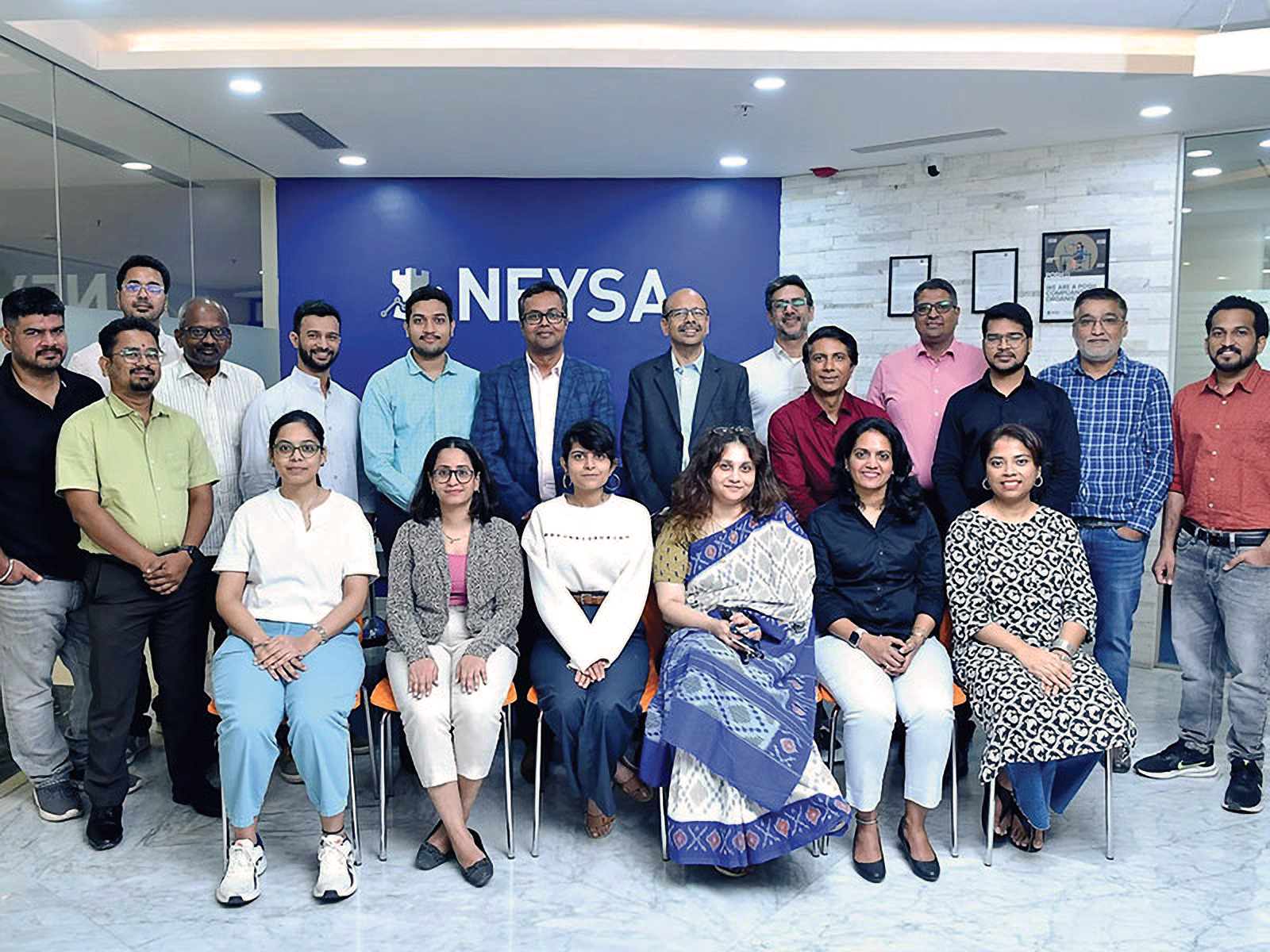 NEYSA leadership team and employees posing at the company’s office headquarters, highlighting corporate culture and innovation in India’s AI and technology sector.