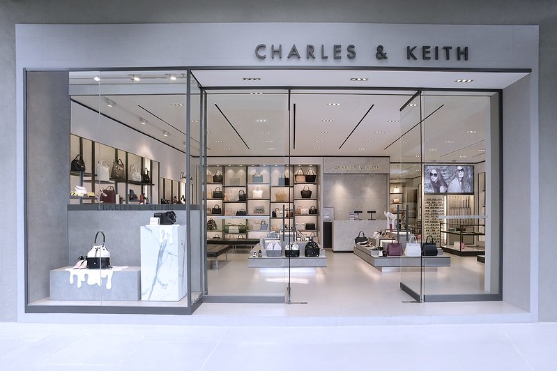 Charles & Keith retail store exterior showcasing handbags and accessories in modern interior.