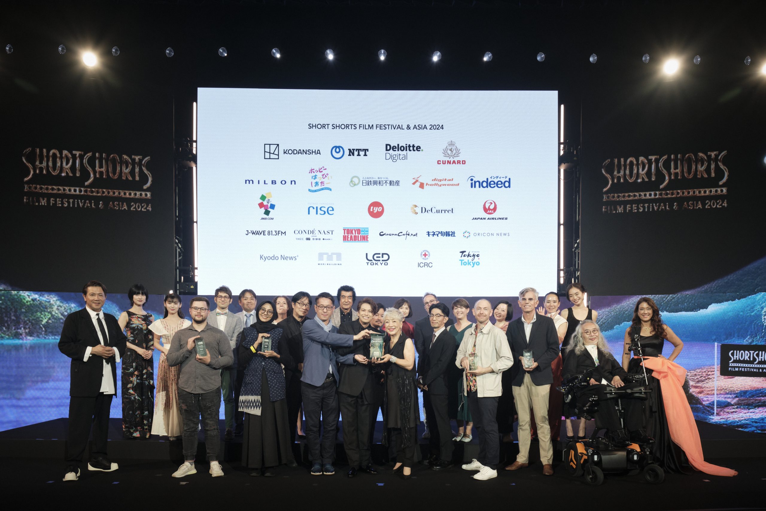Award winners and organizers on stage at the Short Shorts Film Festival & Asia 2024, celebrating excellence in short filmmaking in Tokyo.