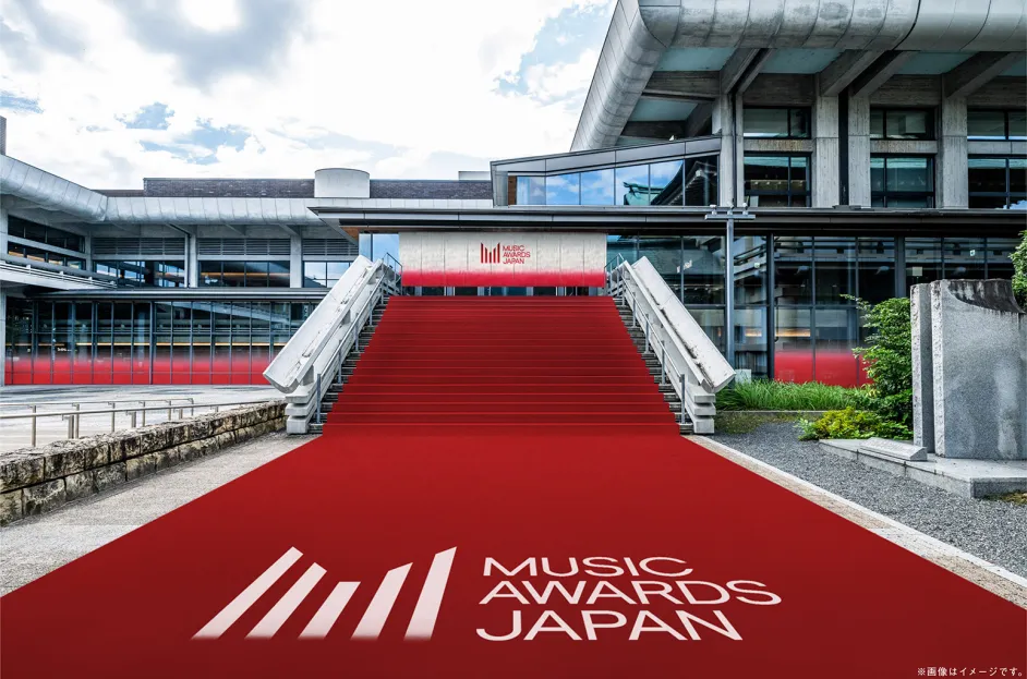 Red carpet entrance at Music Awards Japan event venue with modern architectural backdrop.