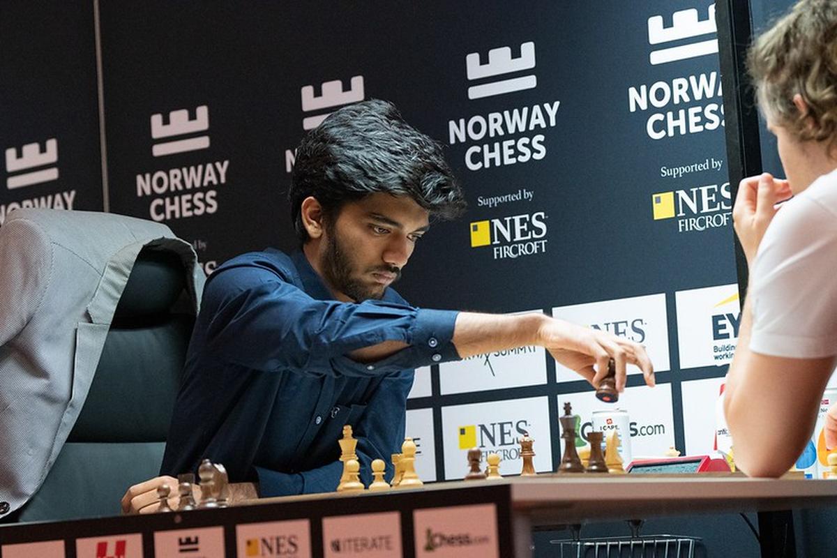 Indian chess grandmaster competes at the Norway Chess 2024 tournament, making a move against an opponent during a high-stakes match