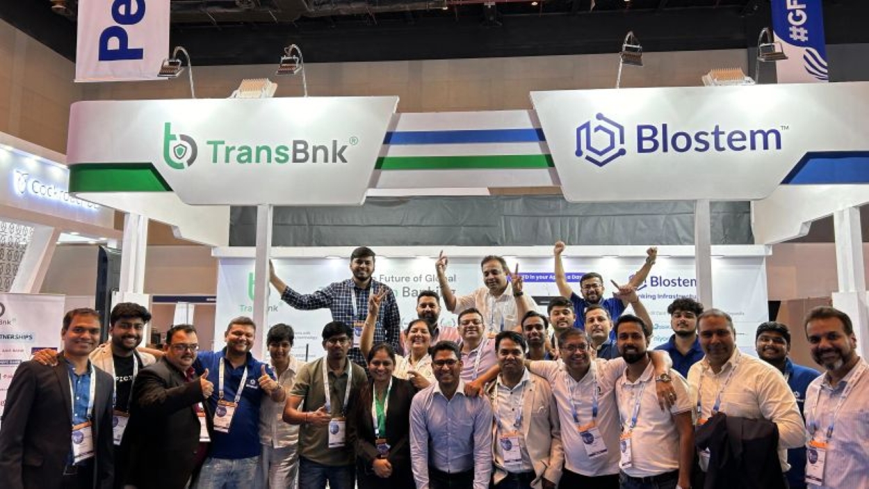 TransBnk and Blostem teams at a fintech expo booth, showcasing digital banking and blockchain innovation in Asia’s growing financial technology ecosystem.