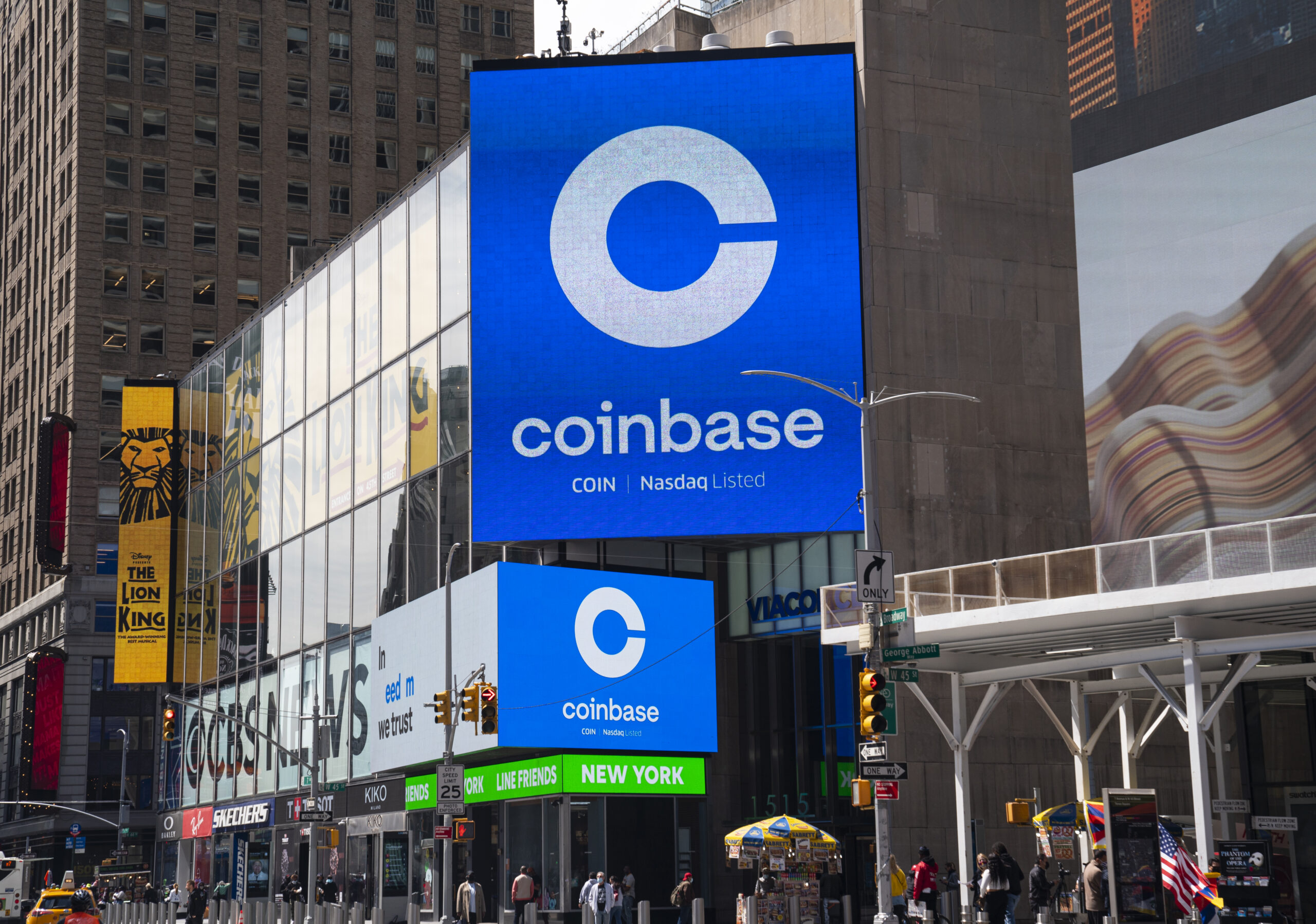 Coinbase digital billboard in New York City, showcasing the Nasdaq-listed cryptocurrency exchange and its role in driving global adoption of digital assets and blockchain finance.