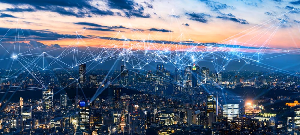 Smart city skyline at sunset with digital network connections visualized, symbolizing Asia’s growth in 5G, IoT, and advanced technology infrastructure for urban innovation.