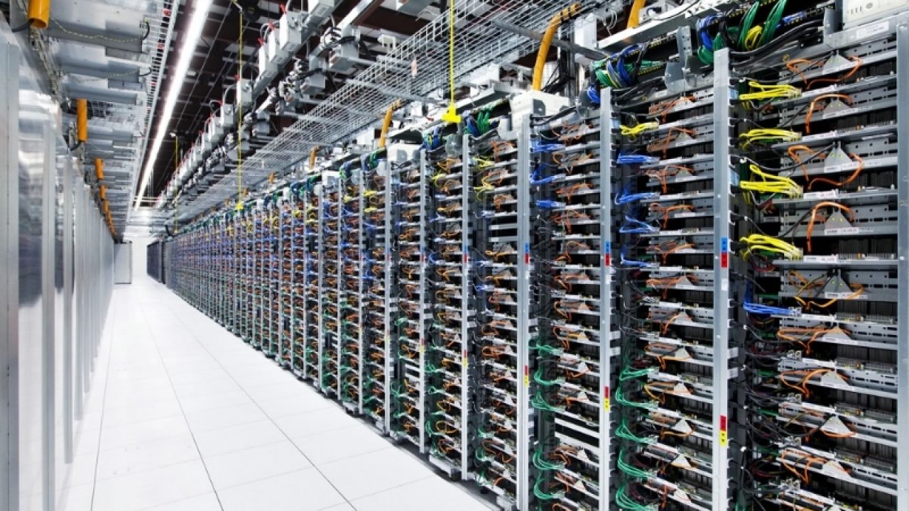 "Rows of high-performance data servers inside a modern data center with network cables and cooling systems for cloud and AI computing.