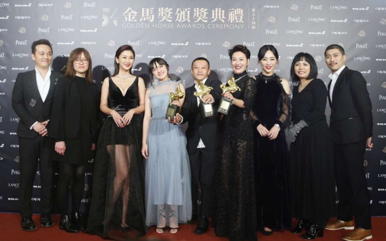 Golden Horse Awards 59th ceremony in Taiwan featuring live stage performance with dancers and vibrant visuals.