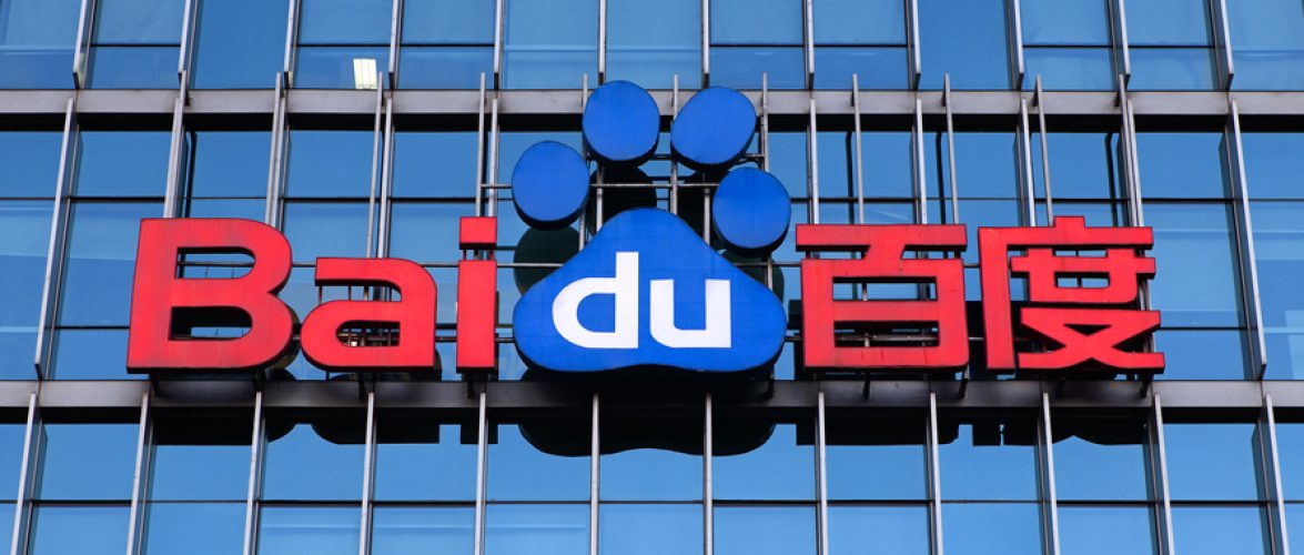 Baidu logo on a glass office building facade, highlighting the Chinese technology and AI company’s corporate headquarters branding.