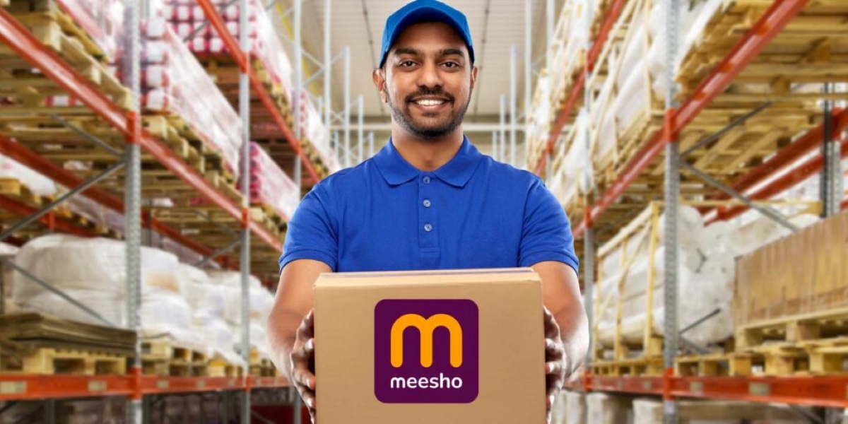 Meesho delivery worker in a blue uniform holding a Meesho-branded parcel inside a warehouse, highlighting the company’s e-commerce logistics and last-mile fulfillment.